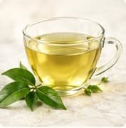 A glass cup of green tea